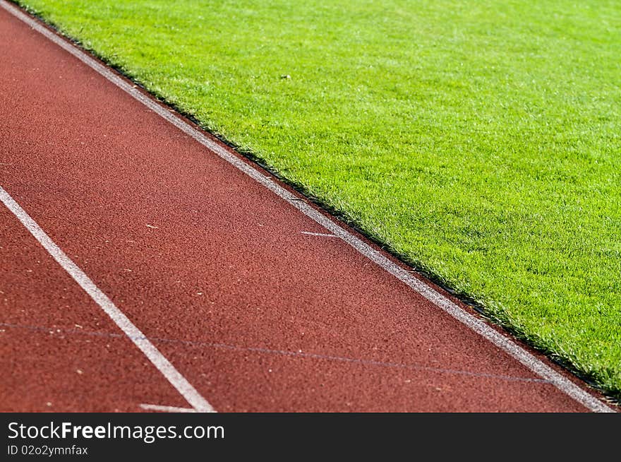 Diagonal race track in soccer stadium in su light