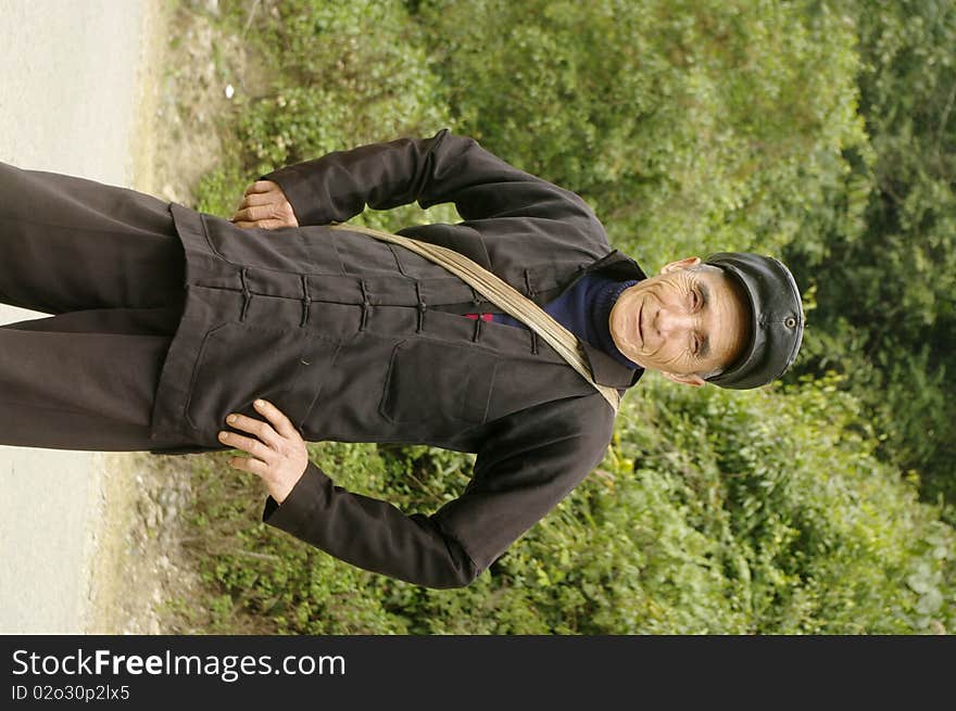 Man of the Hmong in traditional dress. He wears the hat because we Chinese are near the border. Man of the Hmong in traditional dress. He wears the hat because we Chinese are near the border