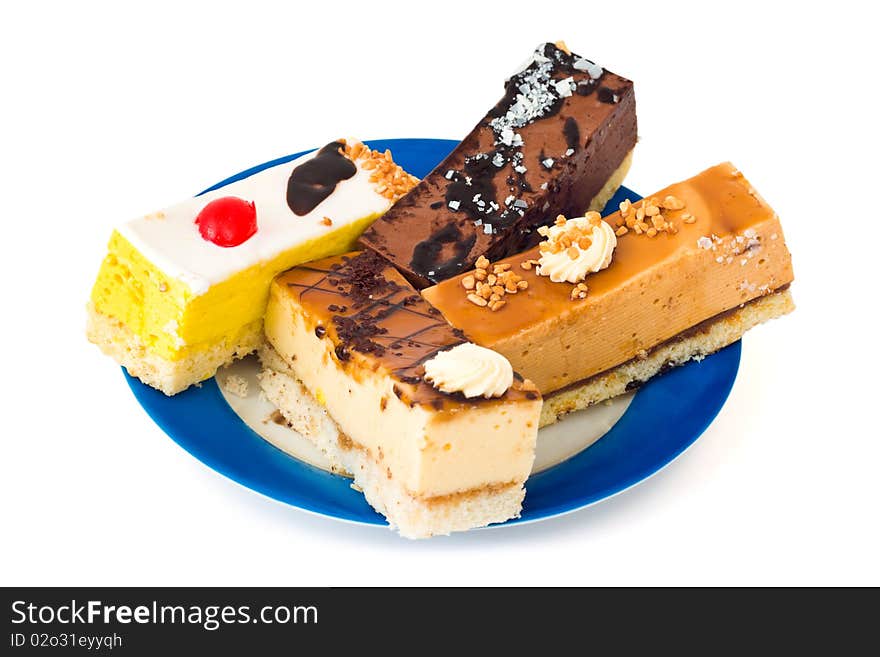 Cakes on plate isolated on white background