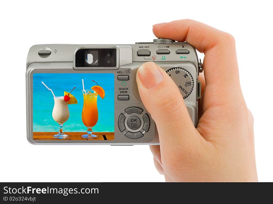 Hand with camera and landscape (my photo) isolated on white background