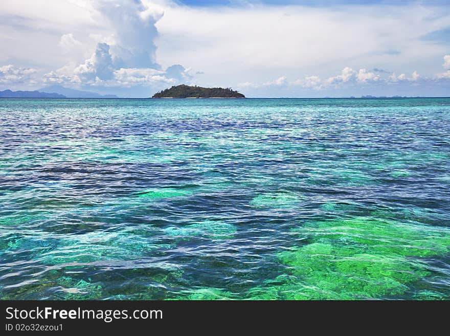 Seascape. Turquoise water, clouds, Islands on horizon. Seascape. Turquoise water, clouds, Islands on horizon