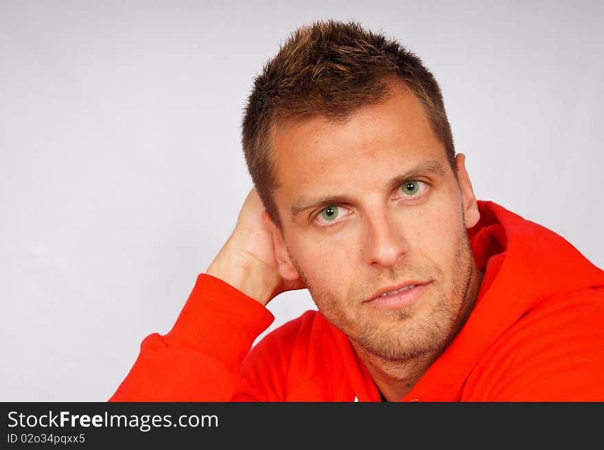 Portrait of young man in red jacket