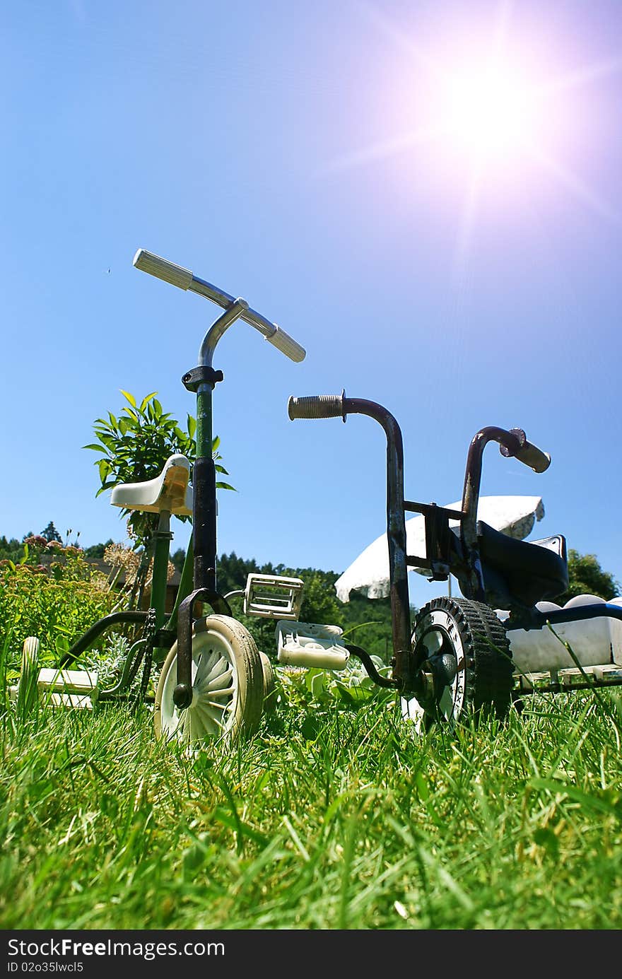 Children's tricycle in the garden. Children's tricycle in the garden