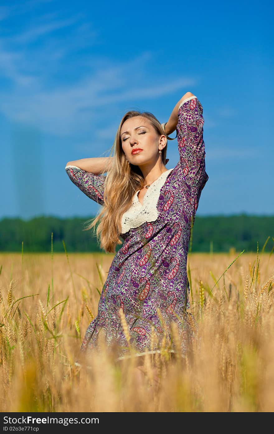 Beauty girl in the wheat field