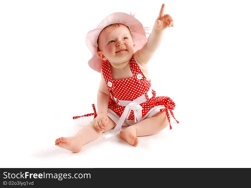 Little baby girl in red dress and hat