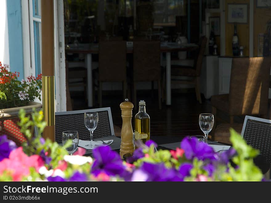 Open-air restaurant with flowers small garden