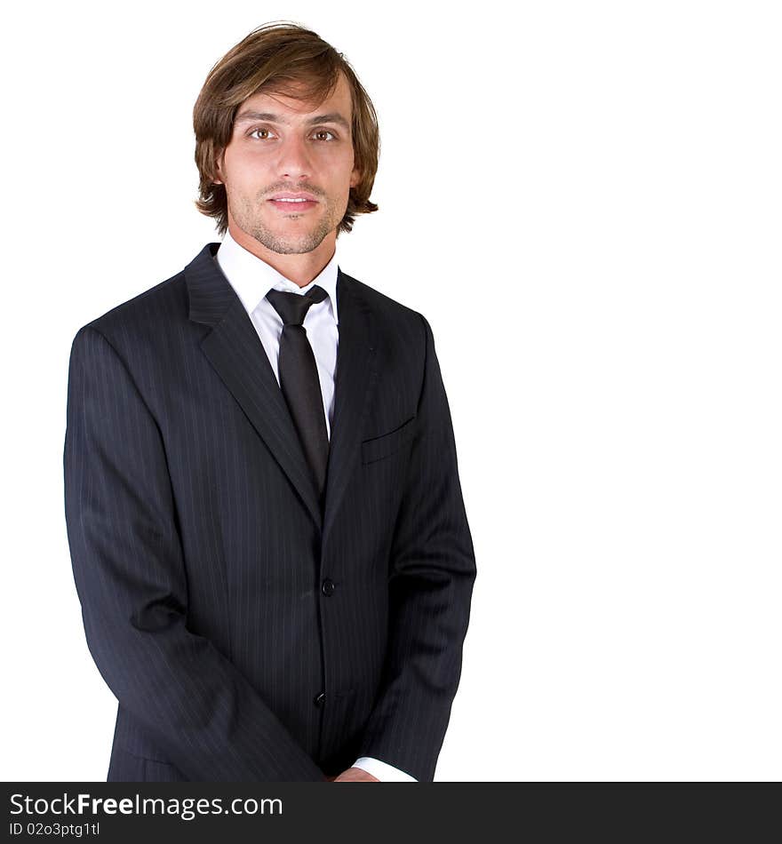 Young fresh confident businessman with longer hair over a greyish background. Young fresh confident businessman with longer hair over a greyish background.