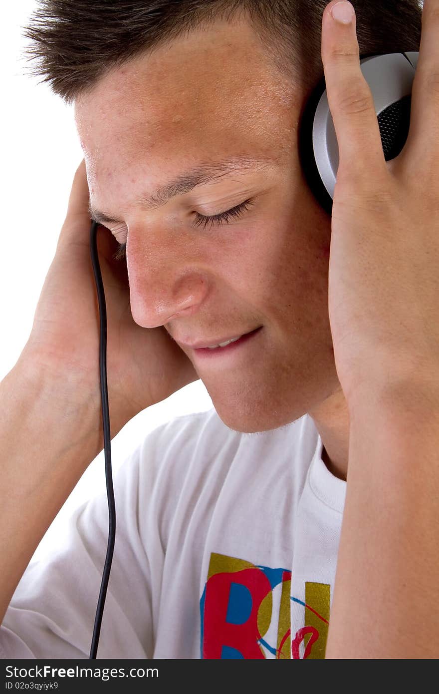 Young fresh teenager with headphones isolated over a white background. Young fresh teenager with headphones isolated over a white background.