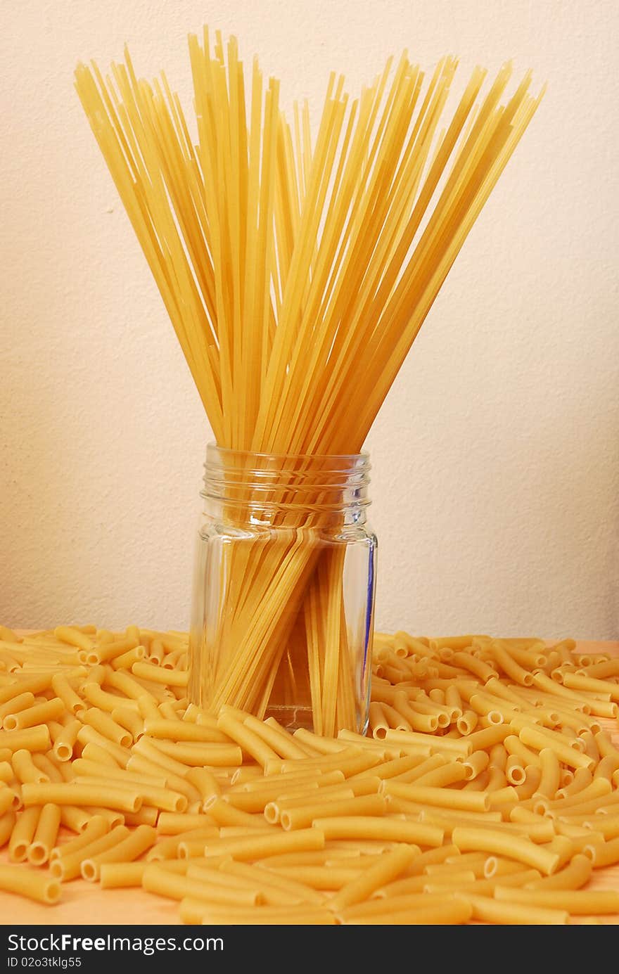 Spaghetti and macaroni on a table