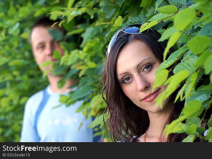 Boy and girl stay together and look at camera. Boy and girl stay together and look at camera