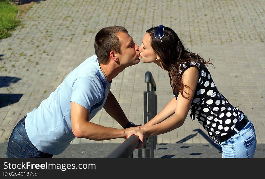 Boy and girl kissing in the park