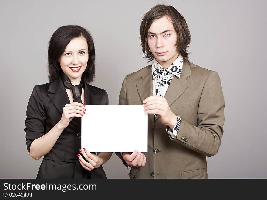 Three business person woman and man to hold a paper look in a chamber. Three business person woman and man to hold a paper look in a chamber