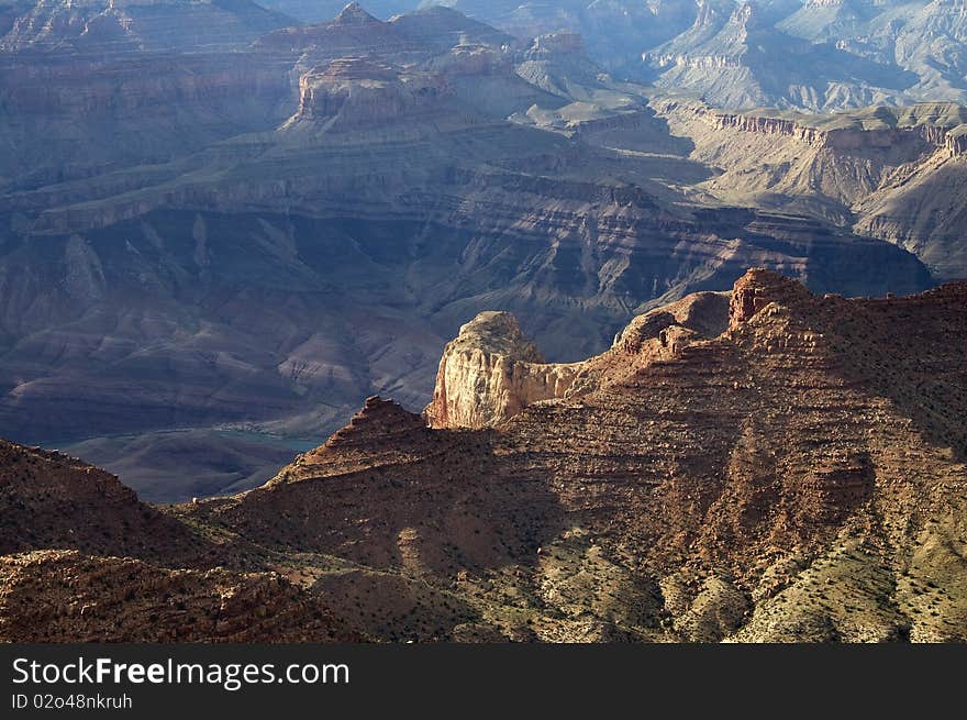 Scenic view of a peak in the Grand Canyon in the evening. Scenic view of a peak in the Grand Canyon in the evening.