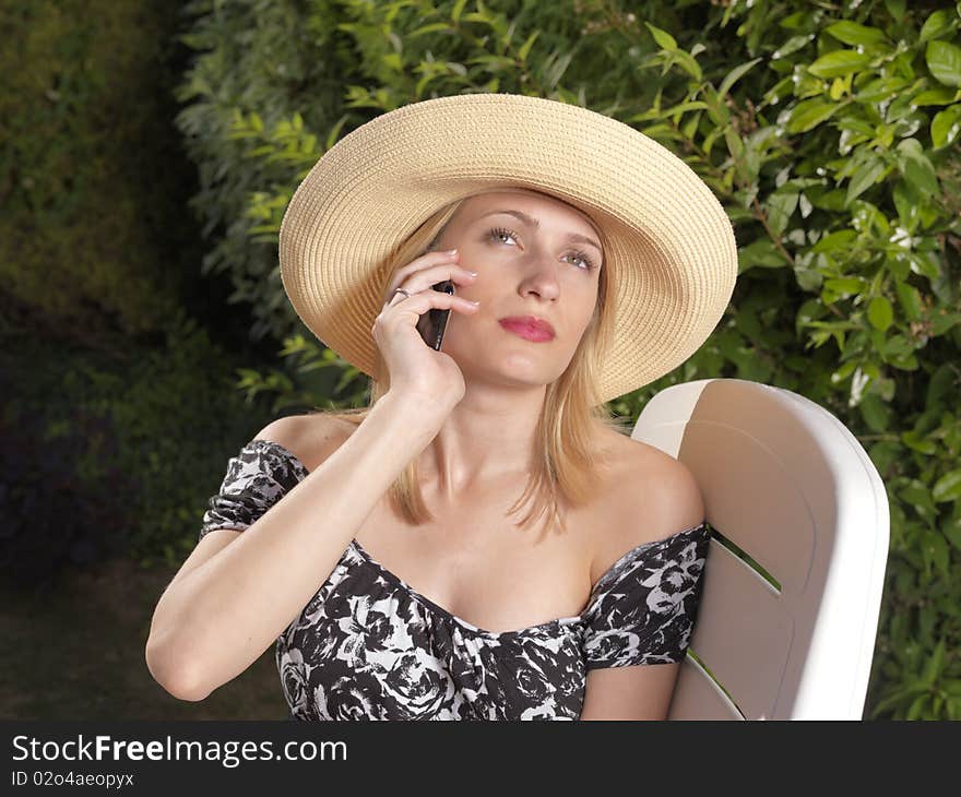 Confident Blond Woman On Mobile Phone