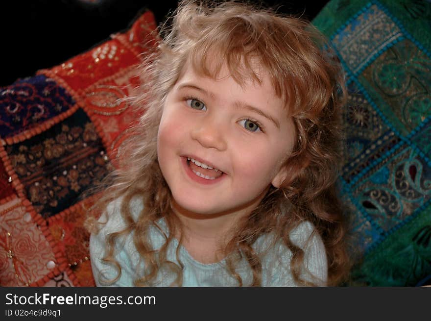 Three year old girl with curly blond hair. Three year old girl with curly blond hair