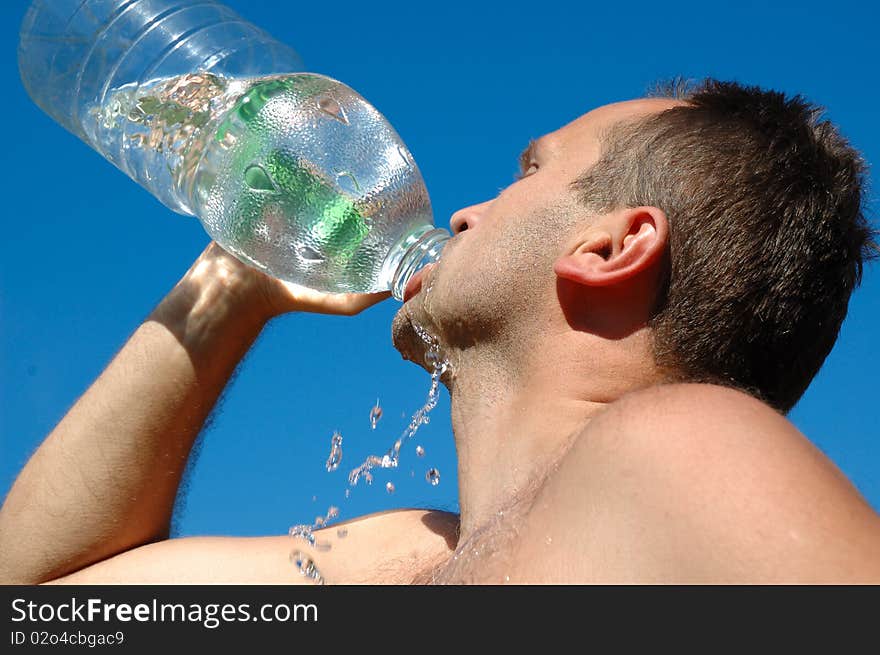 Stubble man drinking a water