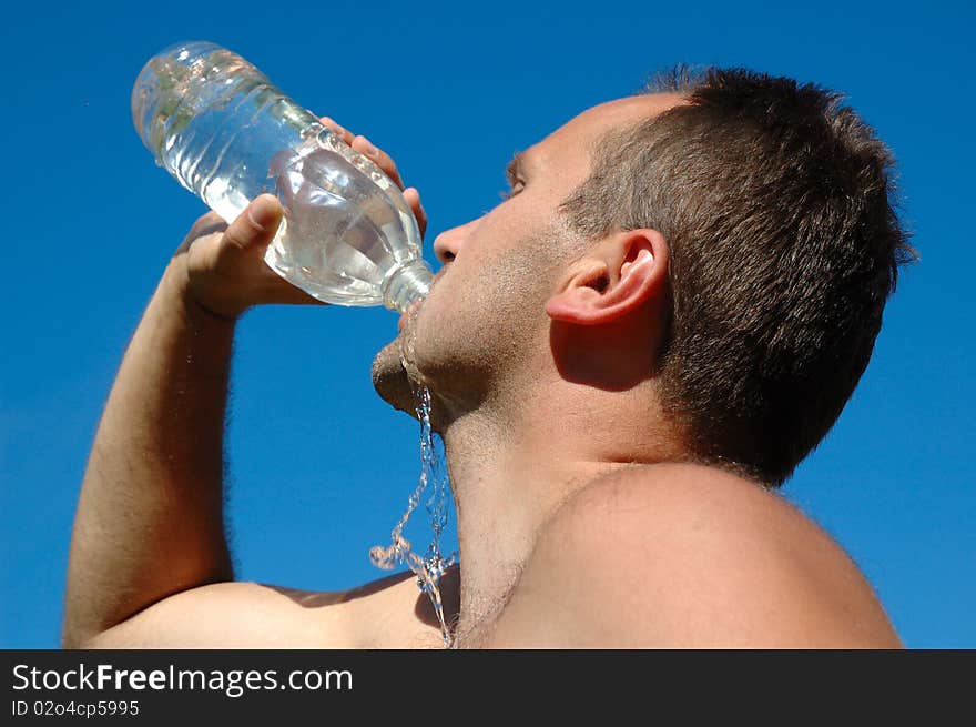 Stubble man drinking a water