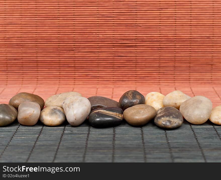 Row of Stones on Japanese Bamboo Mats. Row of Stones on Japanese Bamboo Mats