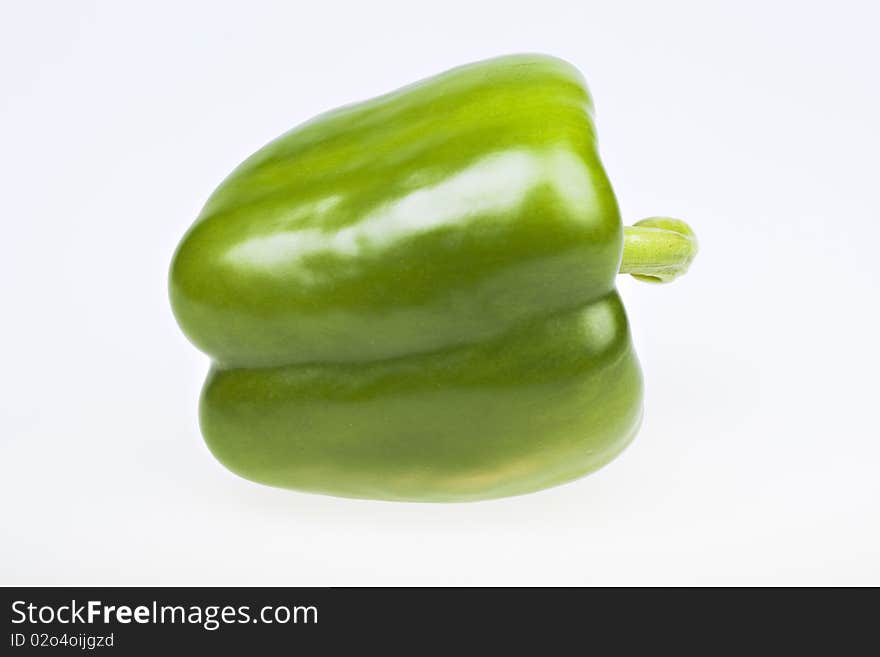 Green yellow pepper isolated on white