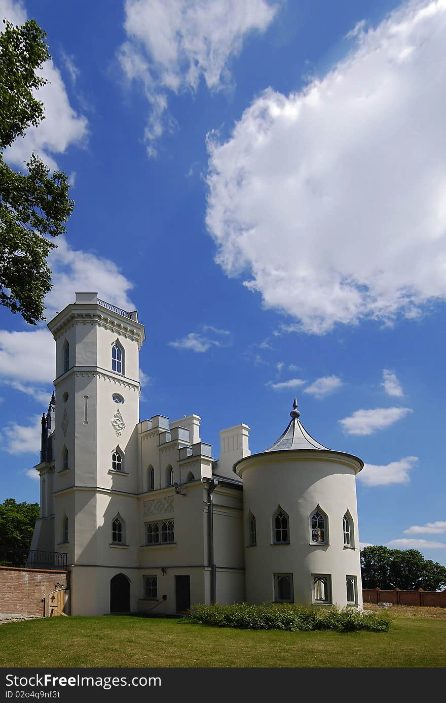 Gothic palace with the garden into a sunny day. Gothic palace with the garden into a sunny day