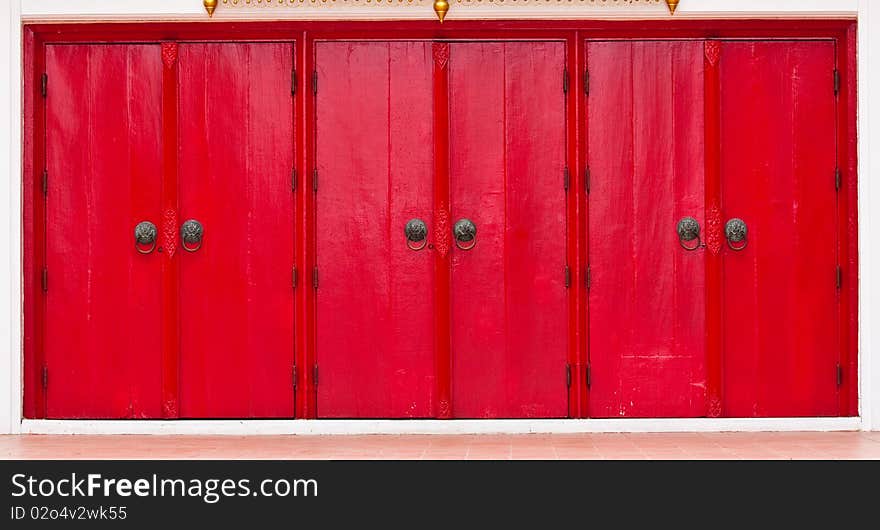 Triple Red Doors with lion head knobs, Chinese decoration style.