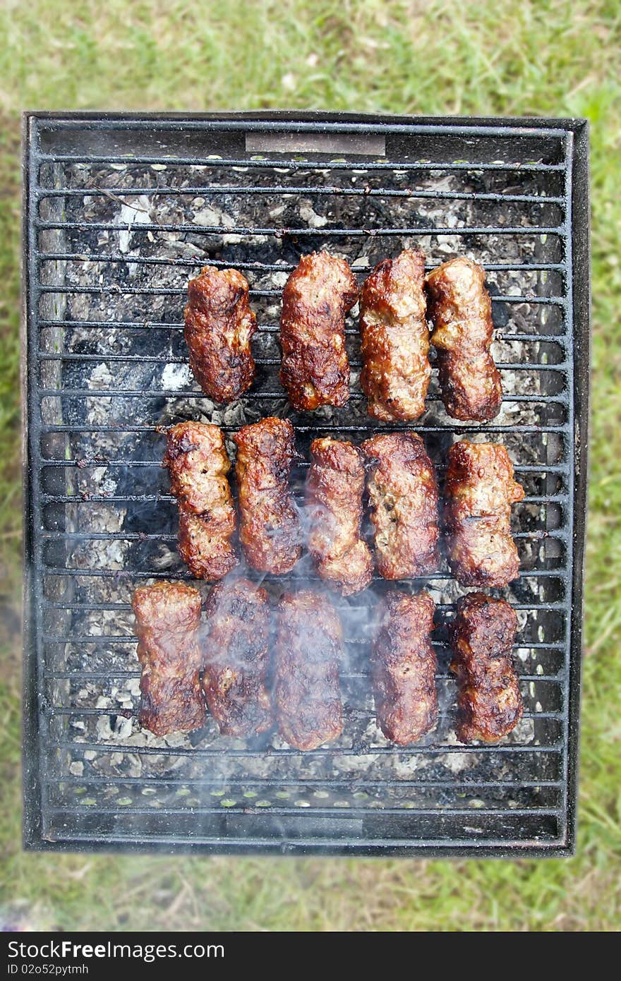 Traditional food mici cooked grilled minced barbecue smoke