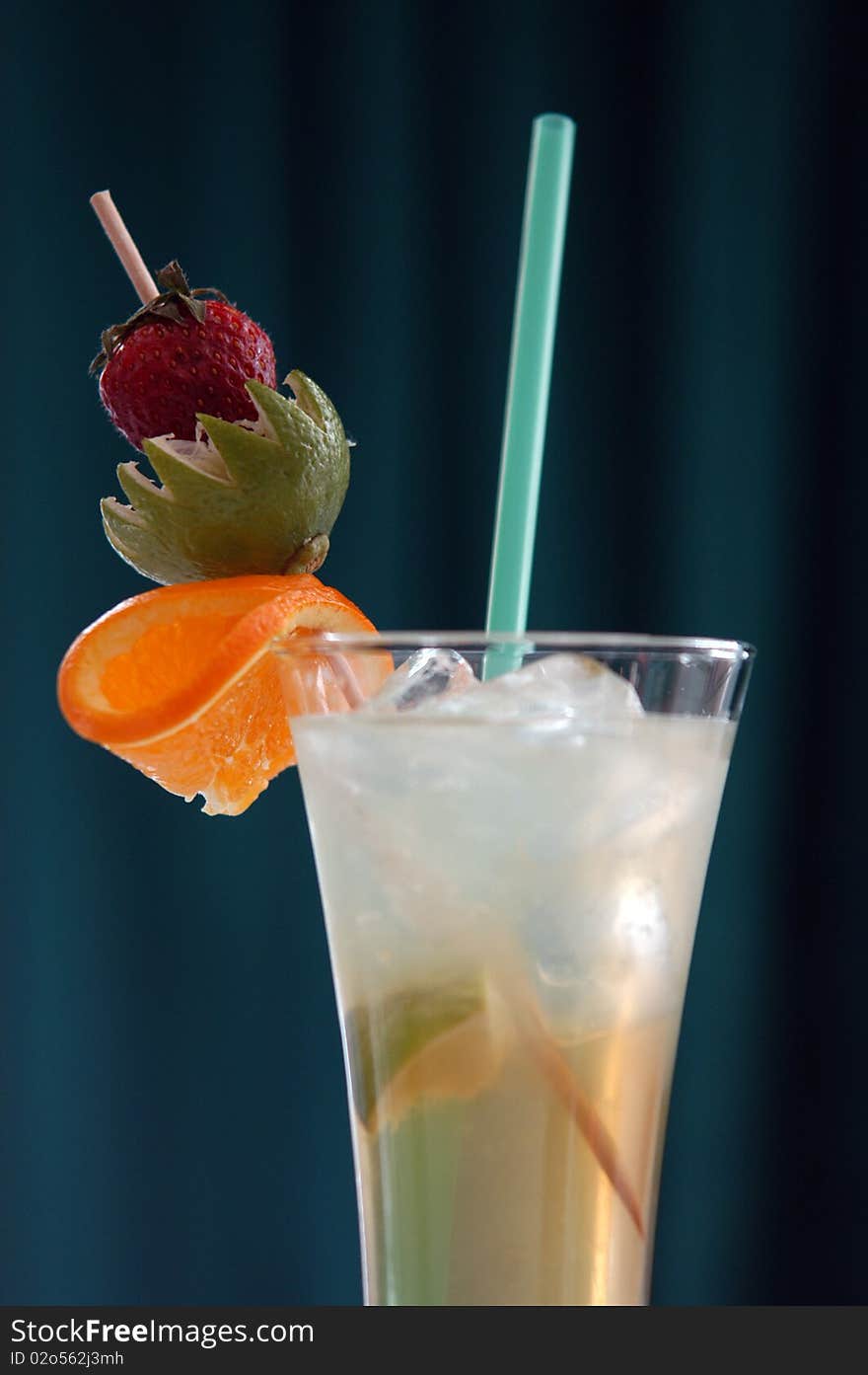 Coctail with ice and straw in glass. Coctail with ice and straw in glass