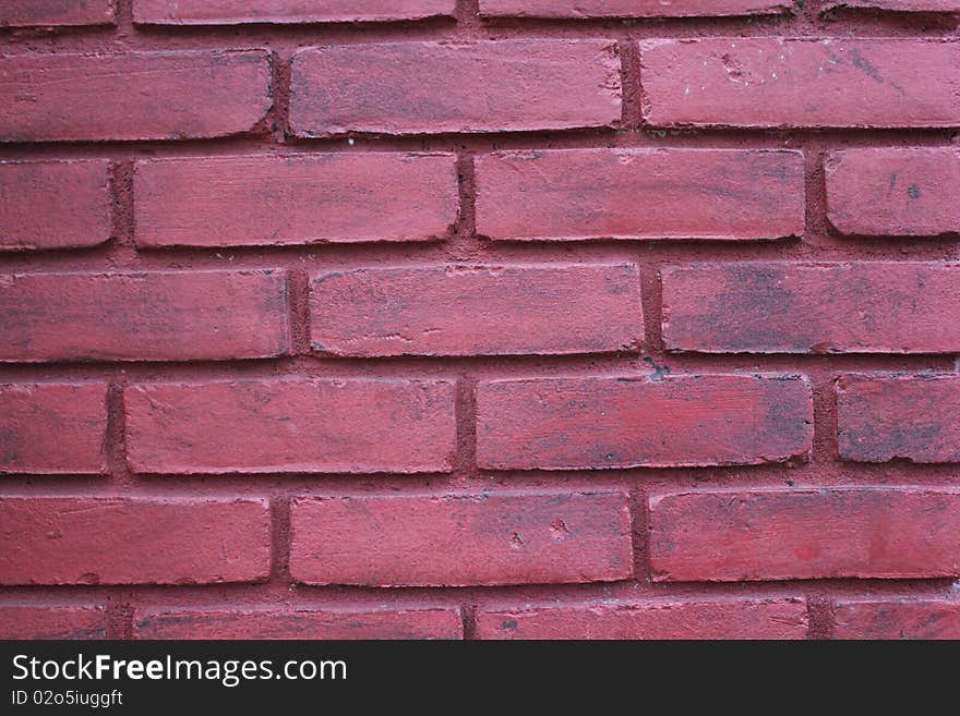 Brick wall that is painted red. Brick wall that is painted red.