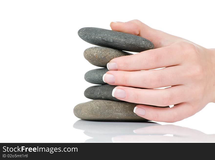 Female Hands Holding Pile Of Stones