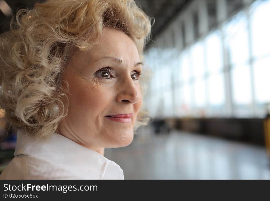 Portrait of a smiling senior woman at the airport. Portrait of a smiling senior woman at the airport