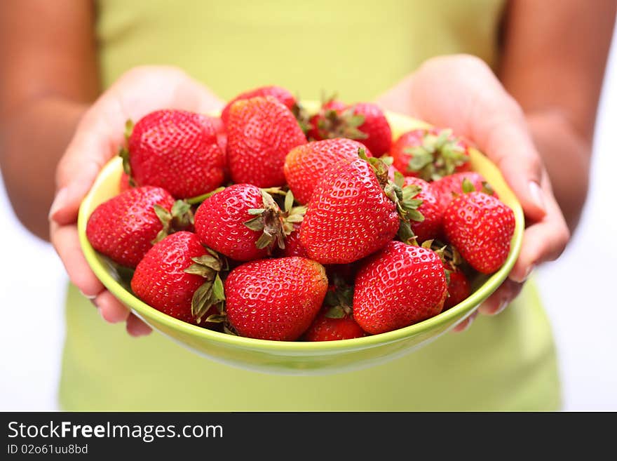 Crockery with strawberries in woman hands. Crockery with strawberries in woman hands.