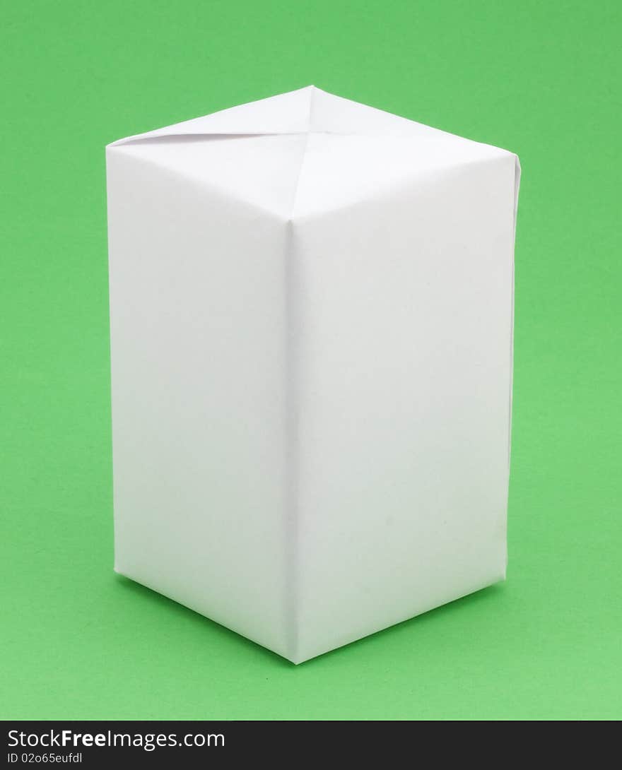 White gift box on a green background