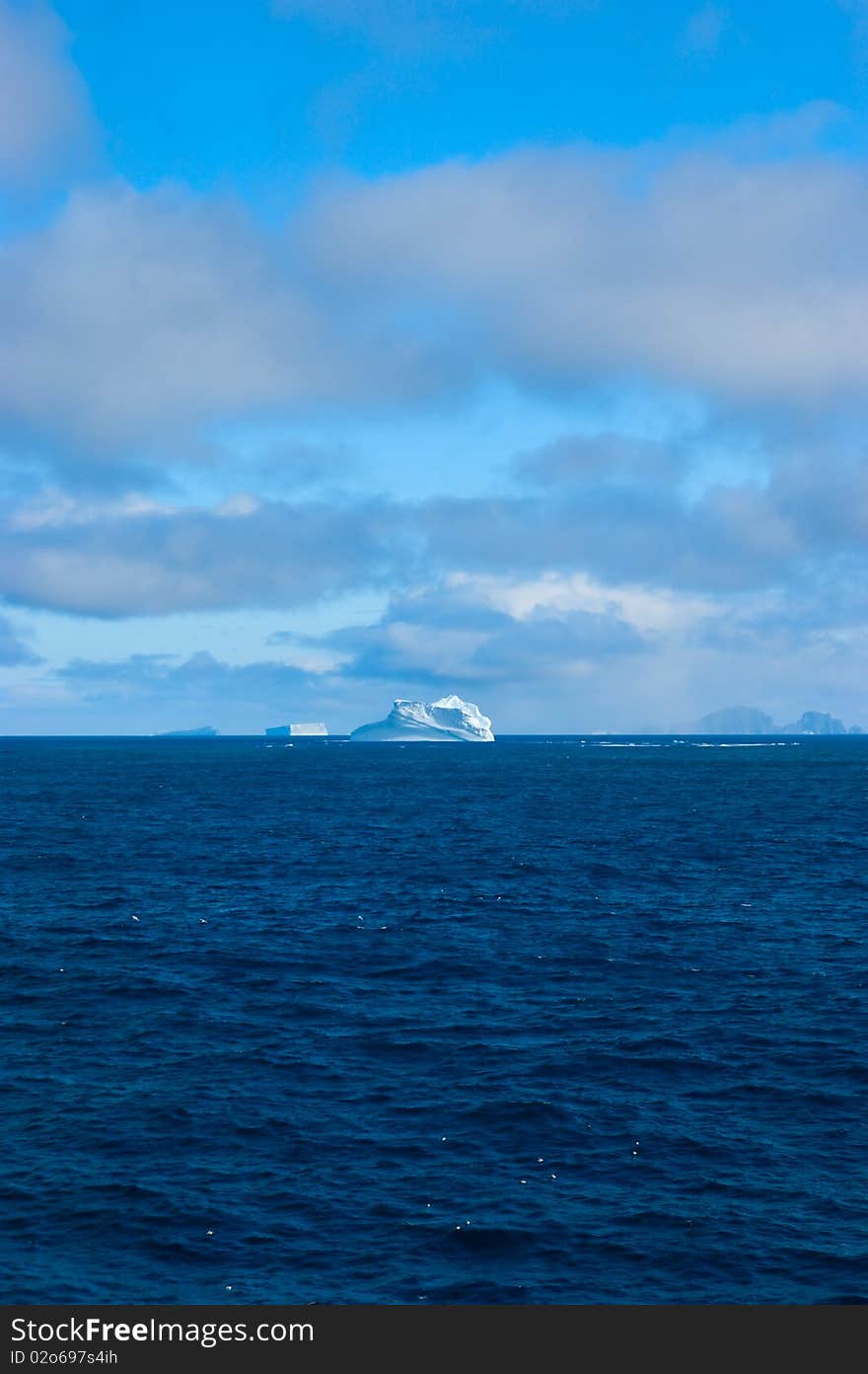 Sea dayly idyll with isberg in antarctic area. Sea dayly idyll with isberg in antarctic area