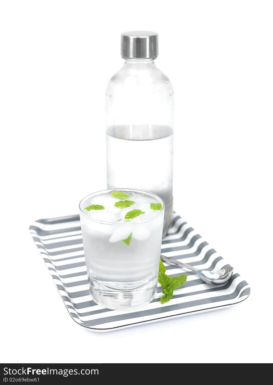 Mint flavoured carbonated water on a serving tray isolated against a white background. Mint flavoured carbonated water on a serving tray isolated against a white background