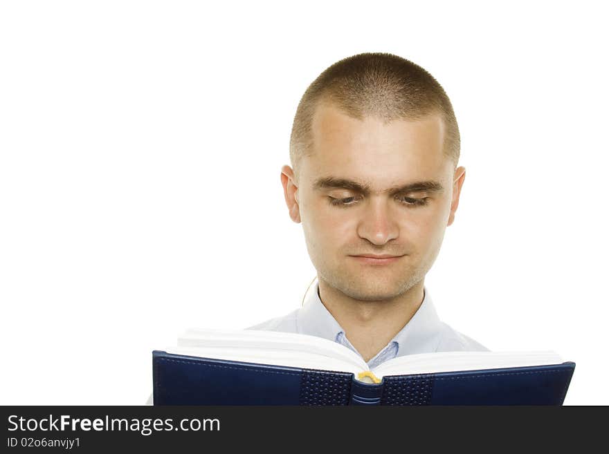 Portrait of a young man holding a blue notebook on white background