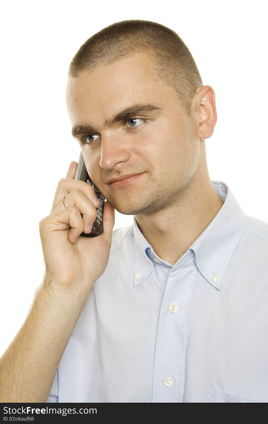 Close-up of young businessman talking on the phone on a white background. Close-up of young businessman talking on the phone on a white background