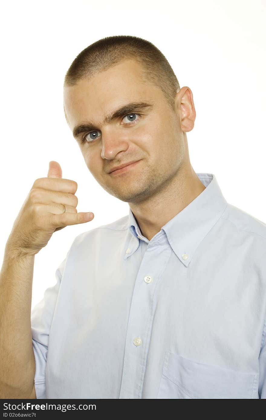 Young man on a white background shows a sign give me a call. Young man on a white background shows a sign give me a call