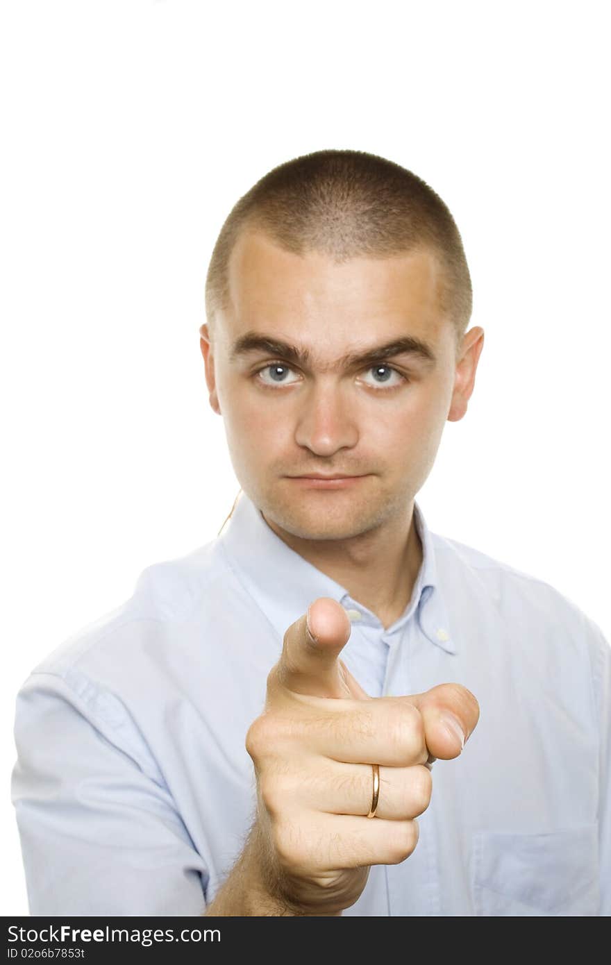 Young man from a businessman in a blue shirt on a white background. Specify finger. Young man from a businessman in a blue shirt on a white background. Specify finger