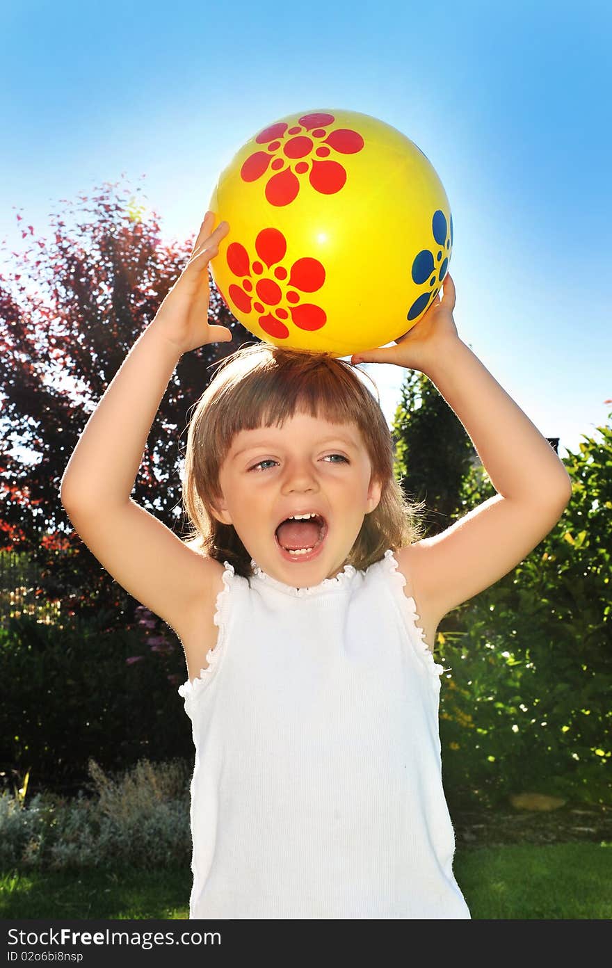 Little girl 3 years old with ball in the garden. Little girl 3 years old with ball in the garden