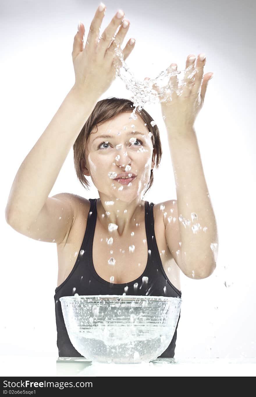 Young woman playing with water. Young woman playing with water