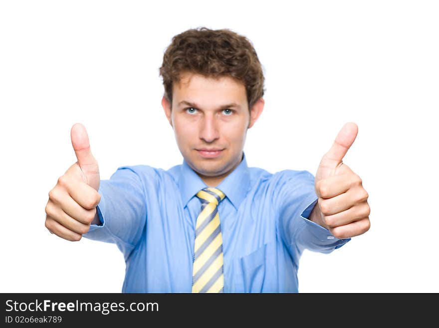 Young male wearing blue shirt and yellow necktie shows thumb up gesture, studio shoot isolated on white. Young male wearing blue shirt and yellow necktie shows thumb up gesture, studio shoot isolated on white