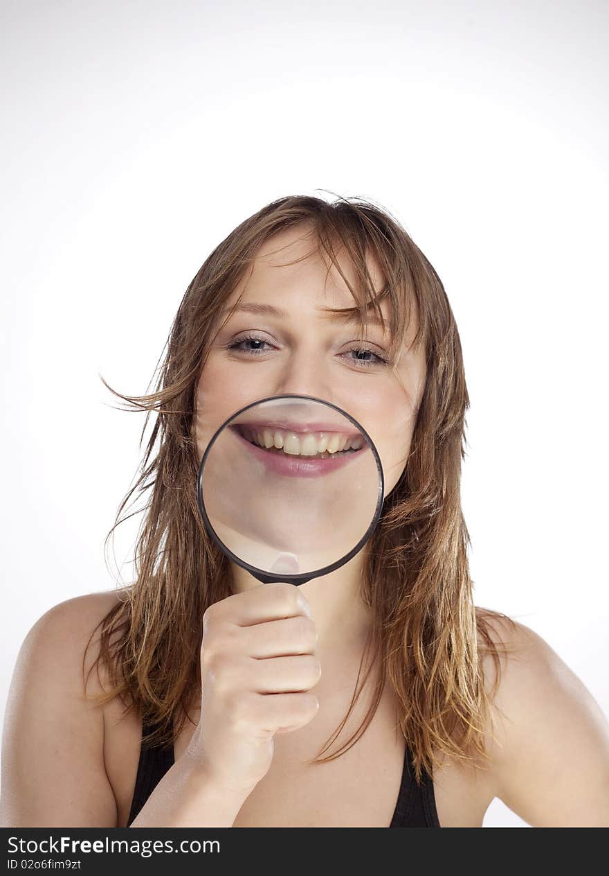 Portrait of woman with magnifier lens