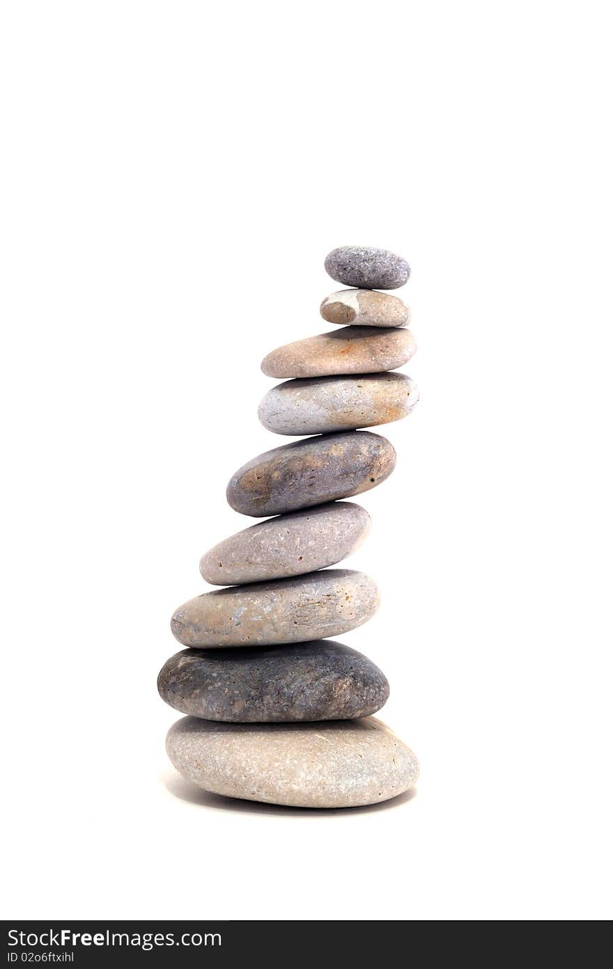 Pyramid of pebbles on a white background