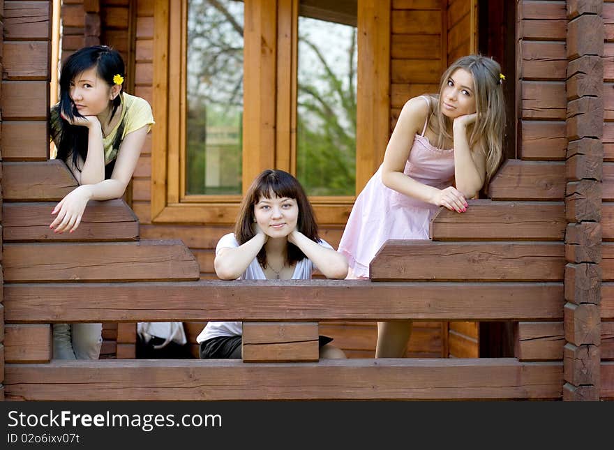 Three female friends on a veranda