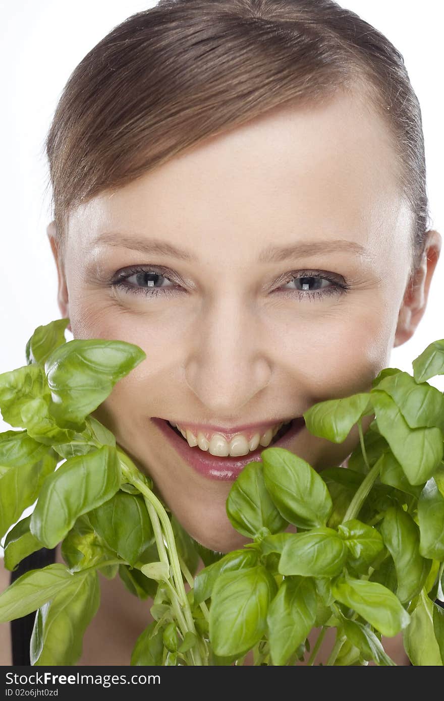 Portrait of woman with basil