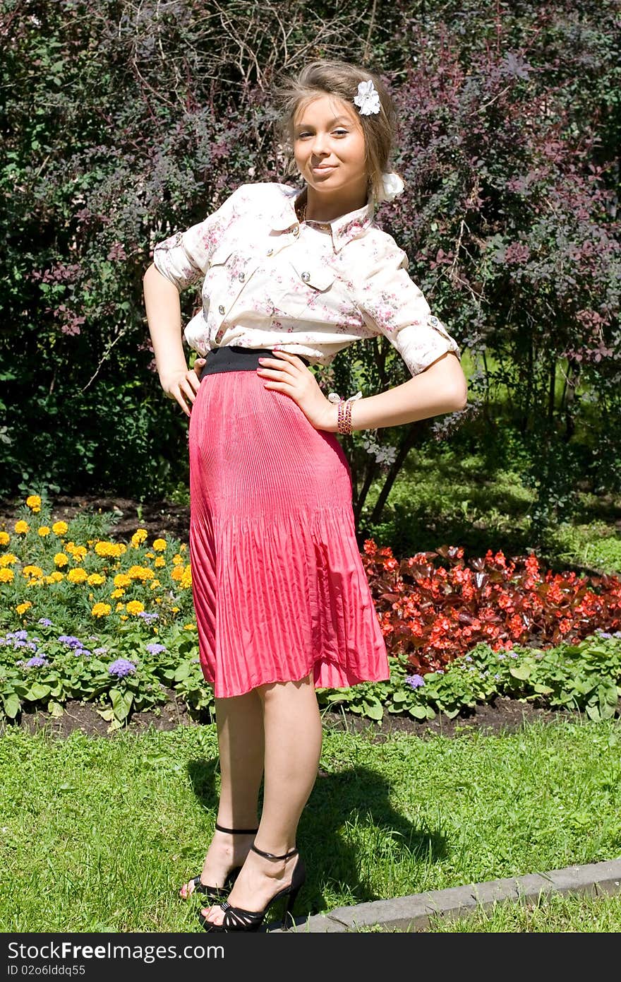 Girl standing in her garden. Girl standing in her garden