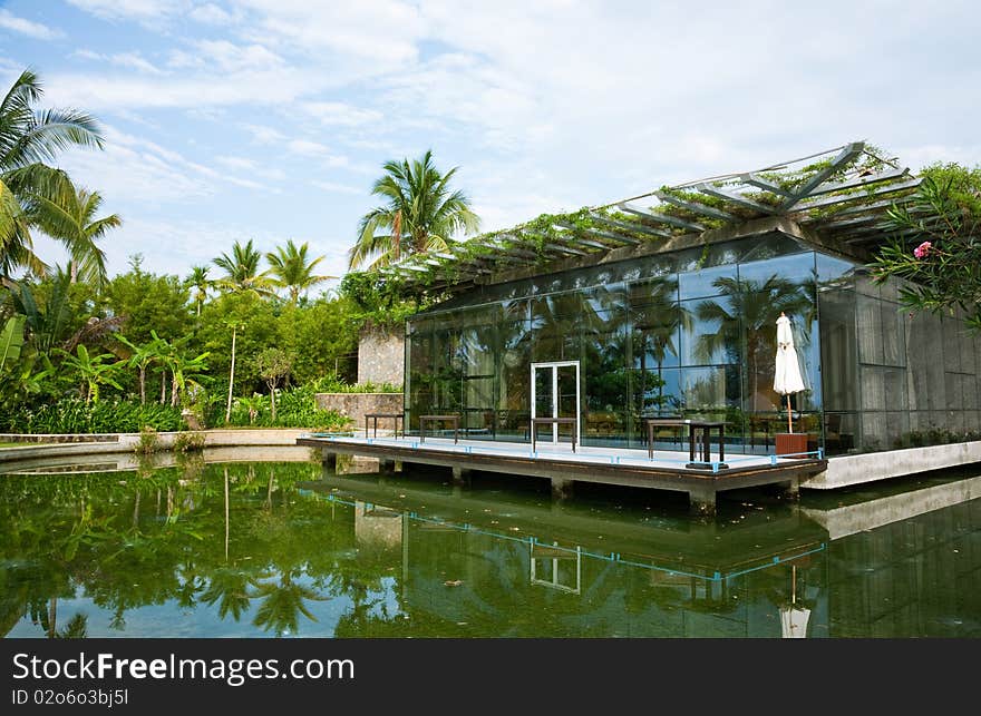 Tropical resort tropical resort with a greenhouse by the lakeside. Tropical resort tropical resort with a greenhouse by the lakeside.