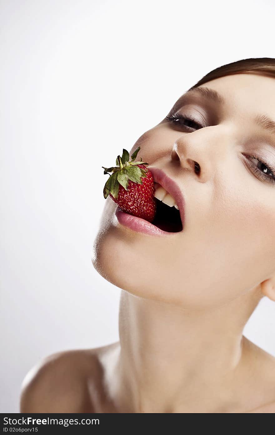 Portrait of woman with strawberry