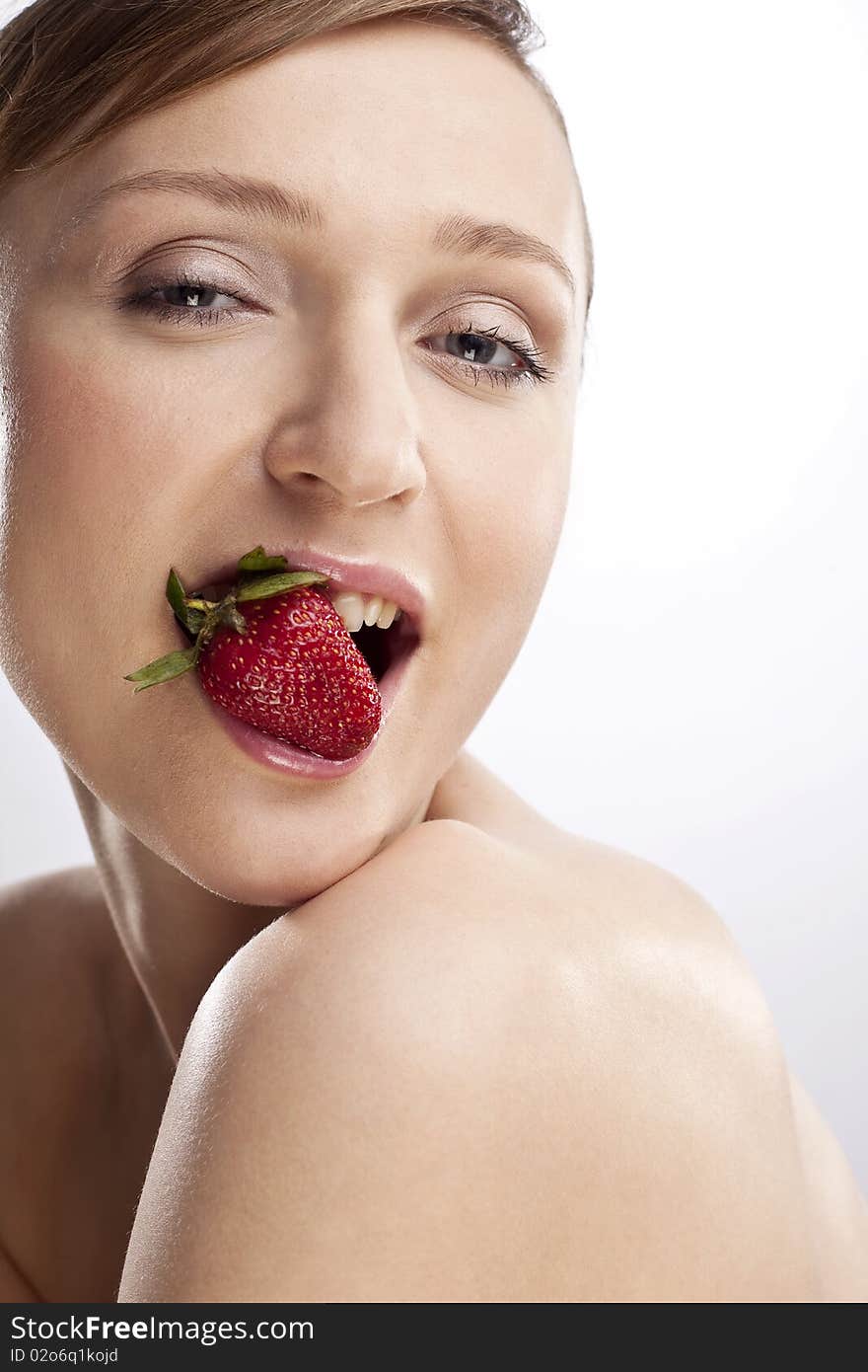 Portrait of woman with strawberry