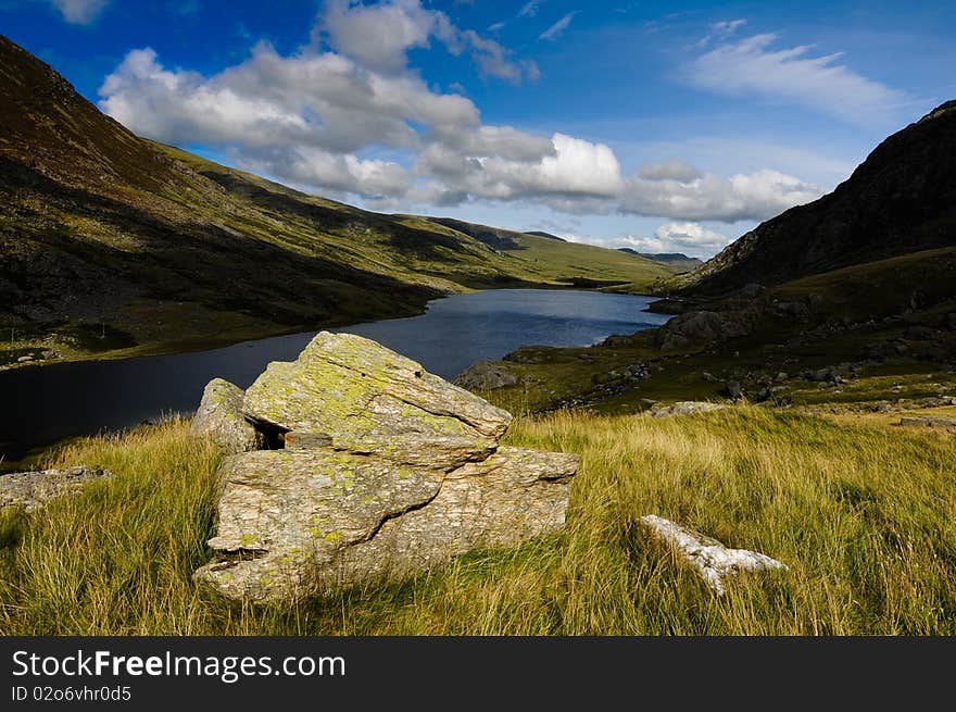 Panoramic landscape view of lake mountains and clear blue sky. Panoramic landscape view of lake mountains and clear blue sky